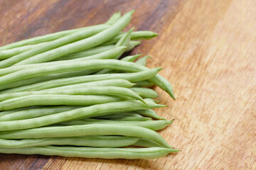Fresh needle beans on cutting board