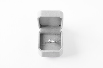 Beautiful ring with gemstone in box on white background
