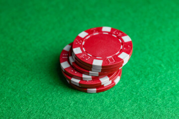 Poker game. Casino chips on green table