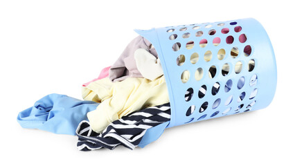 Overturned laundry basket full of clothes isolated on white