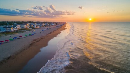 Breathtaking sunrise over Rehoboth Beach illuminating the tranquil waves and sandy shore along the Atlantic coast