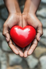 Fototapeta premium Human hands holding a heart on palms