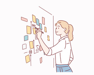  male employee write on colorful sticky notes develop business project in office, concentrated biracial man worker brainstorm engaged in creative thinking make startup plan.