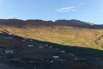 View of the hikkim village in the spiti valley with himalaya mountains and the world's highest post office in spiti valley himachal pradesh, India. 