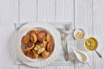 Northern Pike fish cakes in a white bowl