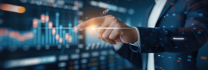 Close-up of business professional pointing at digital data interface with illuminated charts