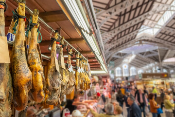 Traditional Jamon meat shop in Central Market of Valencia, Spain