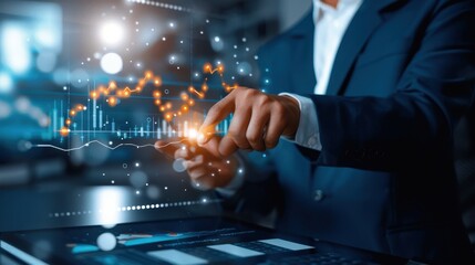 Business professional analyzing financial data on tablet with futuristic digital graphs and glowing charts