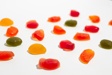 Colorful gummy candies on isolated white background