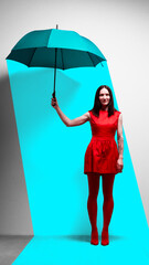 Woman in red dress standing under umbrella under with blue spotlight. Resilience, contrast, and standing out. Contemporary art collage. Concept of psychology, feelings, mental health