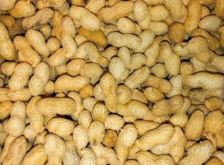 Top view with many peanuts in the shell at the store