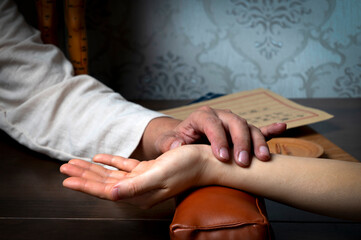 Traditional Chinese Medicine is diagnosing women's pulse
