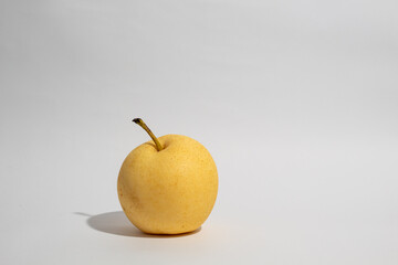 Fresh golden chinese pear on white isolated background