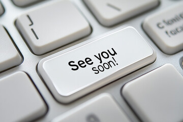 A photograph of the text See you soon! on a computer keyboard button