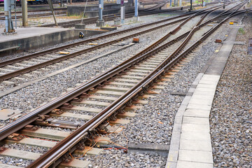 High angle view of railway track with gravel and concrete railway sleepers at Swiss railway station Zürich Altstetten on an autumn day. Photo taken November 11th, 2024, Zurich, Switzerland.