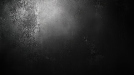 Dark, textured surface with a subtle spotlight highlighting a section