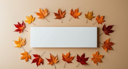 White blank sign with autumn leaves on a sand beige background.