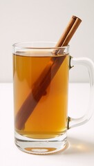 Whiskey honey lemon and cinnamon stick combined for a hot toddy drink served in a clear mug