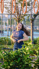 Moments of a slightly overweight teenage girl having fun in a children's park