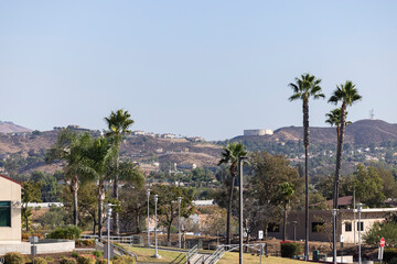 Afternoon winter sun shines on mountains and downtown Norco, California, USA.