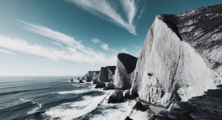 Rocky coastline with sharp cliff edges from above.