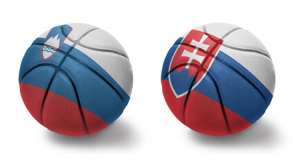 basketball balls with the national flags of slovakia and slovenia on the white background.