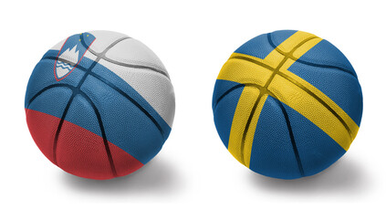 basketball balls with the national flags of sweden and slovenia on the white background.