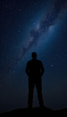 Fototapeta premium Silhouette of man stand and see in the night sky with stars. Galaxy and space. Light from the chest. Astrology sign. Esoterica and psychology isolated with white highlights, png