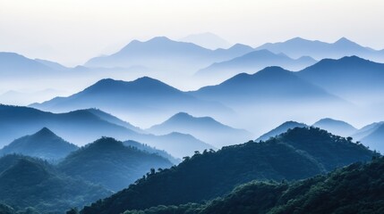 Fototapeta premium Serene Layers of Misty Mountain Ranges at Dawn Showcasing Tranquil Natural Beauty and Majestic Scenic Landscapes in Soft Blue Hues