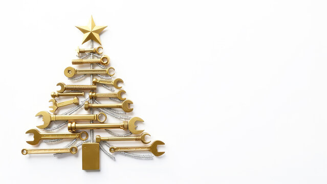 Christmas tree made of gold wrenches decorated with balls on a white background. New Year banner with tools. Postcard with place for greeting text for happy new year with industrial holiday concept.
