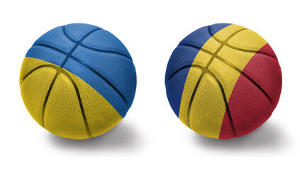 basketball balls with the national flags of romania and ukraine on the white background.