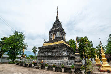 Fototapeta premium Exterior of the Wat Ho Siang stupa temple in Luang Prabang, Laos, Asia