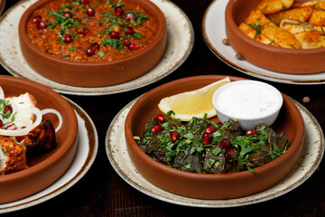 Assorted traditional Georgian cuisine on a black wooden table