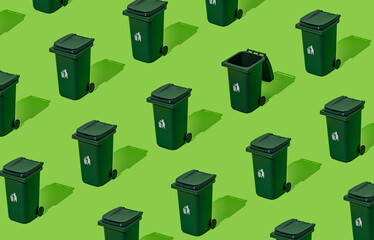 Creative eco pattern made of trash recycle bin on green background. Container for disposal garbage waste and save environment. Minimal earth day concept. Green eco pattern backdrop.