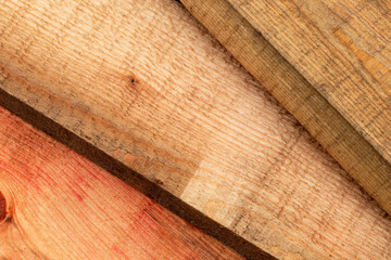 Stack of wooden boards at a sawmill, close up background