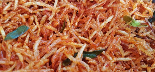 Kentang kering mustofa balado or dried crispy spicy potatoes is delicious traditional food from Indonesia