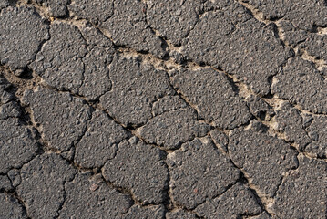 Cracked asphalt texture. Top view. Asphalt. Road background