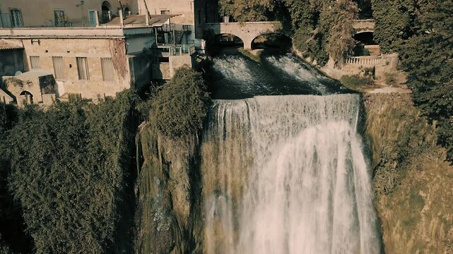 Close angle of the waterfall of Isola Liri: Smooth moving drone over the town of Isola del Liri in the heart of Ciociaria