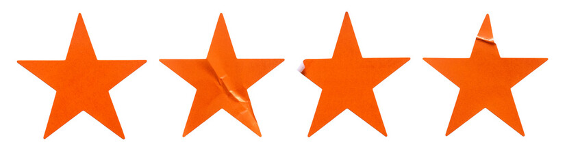 A set of orange star shape paper sticker label isolated on white background.