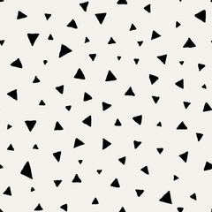 Hand drawn triangles pattern. Black and white geometric background. Seamless vector illustration. Doodle ornament made on a tablet