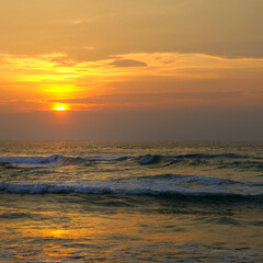 Obraz premium Sea and bright sunrise. Concept - vacation and travel.