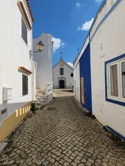 Small church at the end of a cobblestone street in Alte, Portugal