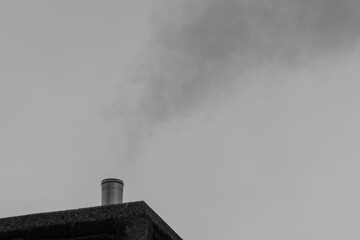 smoke from the chimney in black and white