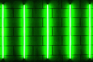 Obraz premium Five green neon bulbs on brick wall. Lighting effect red color glow on brick wall background. 