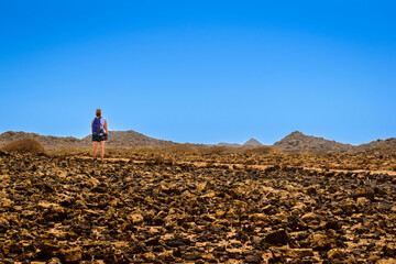 A tourist on Lobos Island on a sunny day