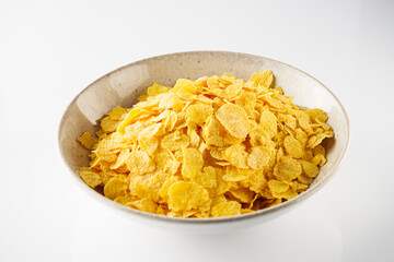 Crispy Corn Flakes with Milk Splash, Healthy Breakfast Cereal in Bowl, Morning Energy Meal