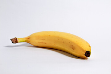 Yellow ripe banana shot on isolated white background