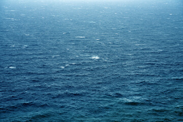 Rain over the stormy sea, abstract dark background landscape	
