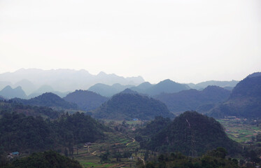 Obraz premium Mountain range of Ha Giang city, Vietnam on a cloudy day
