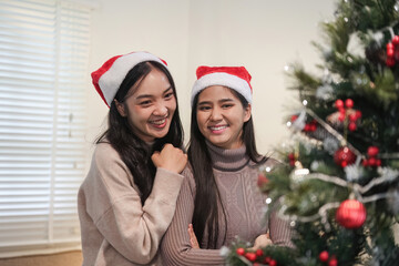 Young Woman Joyfully Decorating Her Room for a Cozy and Festive Christmas Celebration with Love and Holiday Spirit